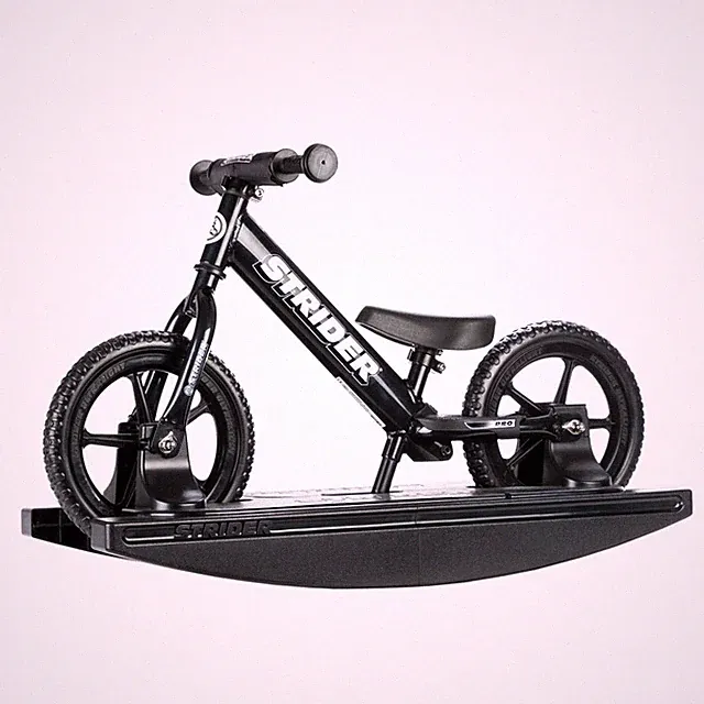 Strider 12 Pro Balance Bike with Rocking Base for Kids 6 Months-4 Years, Black